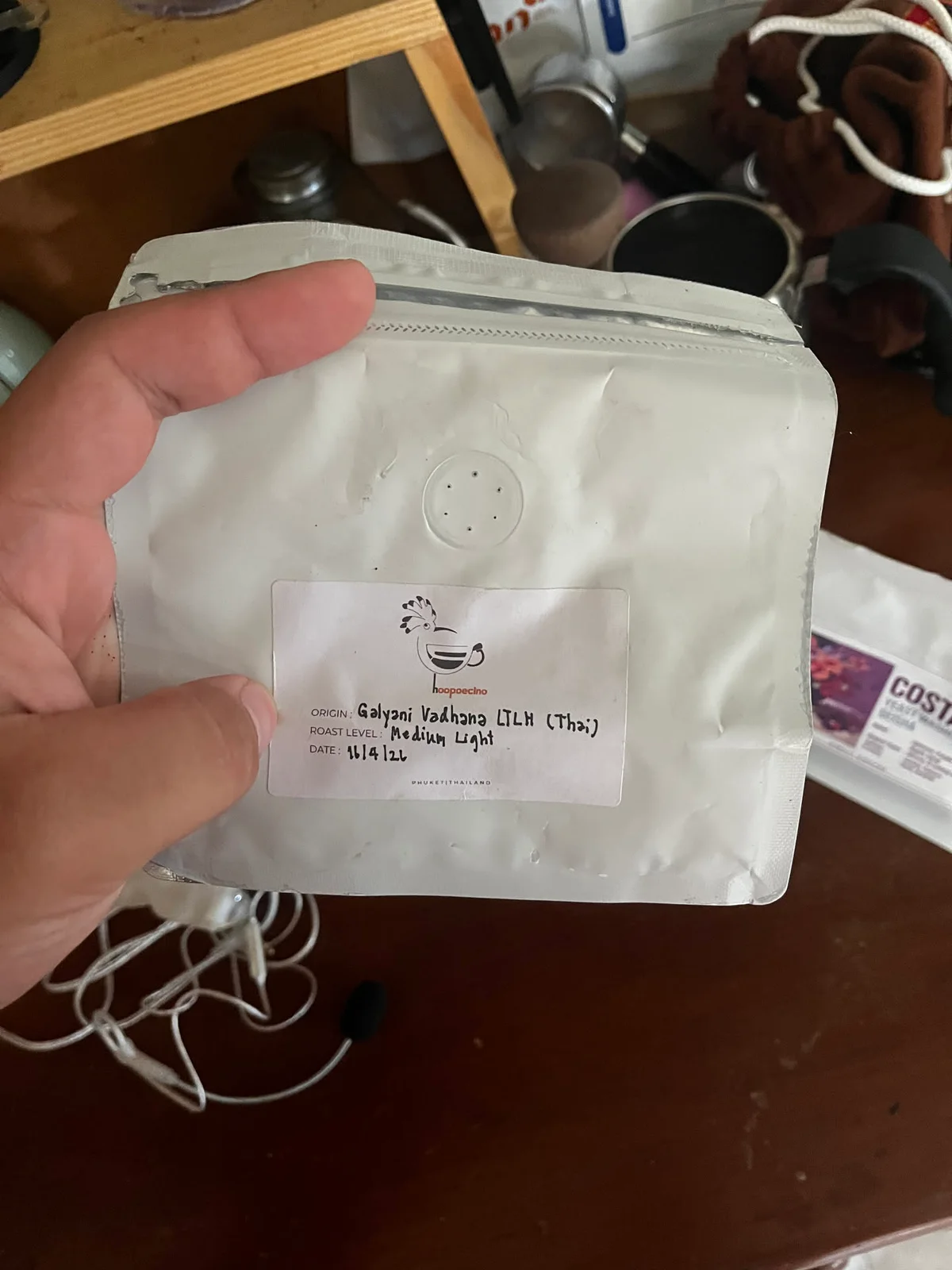 Close-up of a Thai coffee bag at the home coffee station